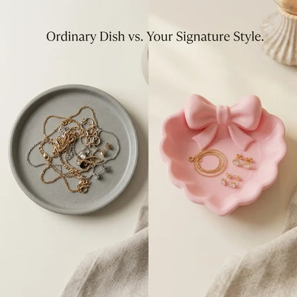 A heart-shaped jewelry tray with a pink bow, made using 3D printing technology, is suitable for placement on a dressing table, s
